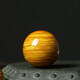 The old version of Fengchengxiang style golden nanmu wood ball solid wood carving handpiece fitness ball play massage ball handpiece handpiece full of water wave golden nanmu ball