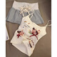 Schauen Sie sich auch niedlichen Welpendruck mit Brustpolster kleiner Hosenträger Pyjamas für Frauen im Sommer im Sommer Heiße Mädchen Weste Striped Shorts Home Clothing Set S2506 süßer Welpe festes Brustpolster M.