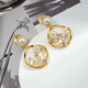Shijun (SHIJUN) non-pierced ear clips, high-end, light luxury, shell flower hollow earrings, versatile earrings for women, imitation pearl niche, mosquito coil disc ear clips, a pair of whitening and sexy