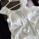 Otro pijama de seda de hielo de lujo ligero de alta gama para mujeres en almohadillas de pecho dulce de verano con pequeñas mangas de moscas pantalones pantalones cortos sueltos para el hogar set de dos piezas 935 almohadillas de cofre fijas de mariposa azul