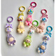 Mini Labubu Labuba Keychain Enamelo Recubierto lindo Bolsas para caminar de grano colgante de teléfono móvil lindo adorno colgante Labuba Color rosa