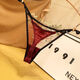 European and American thin strap T-string women's sexy lace invisible seamless high-end imitation silk adjustable belt women's T-string wine red