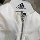 阿迪达斯（adidas）外套女装2025春季新款运动服梭织透气皮肤衣连帽上衣夹克JZ1656 JZ1682白色 XL