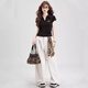 Nome Summer Schulter T-Shirt Top Faden Polo Shirt Frauenseite plissierte schlanke kurzärmelige T-Shirt schwarz Stickstil M.