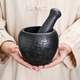 Yusenyi household black gold stone mortar garlic pounder pepper grinder garlic mortar stone pounder stone ladle mortar stone cup pound medicine jar Lianlian Youyu outer diameter 16CM water drop shape internal design 16ml
