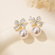 Qlady bow unique earrings earrings for women 2025 new temperament high-end light luxury earrings women's imitation pearl earrings