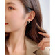 Exquisite and compact mini four-leaf clover earrings spring high-end 2025 new versatile earrings temperament commuter earrings black