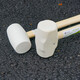 Marujia cooked rubber hammer wooden handle rubber hammer installation tile decoration floor tile installation hammer white solid rubber round hammer surface micro 1000g