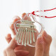 Mini Kalynba 8-tone transparent thumb violin small children's toy musical instrument finger violin portable decoration 8-tone lucky star