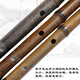 La flûte en bambou violet à la main de M. Guan Zi a joué professionnellement la flûte horizontale sélectionnée MATÉRIAUX SÉLECTIONNEL