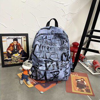 纤多洛书包男潮流韩版印花涂鸦高中生大容量霸气双肩包初中生大学女