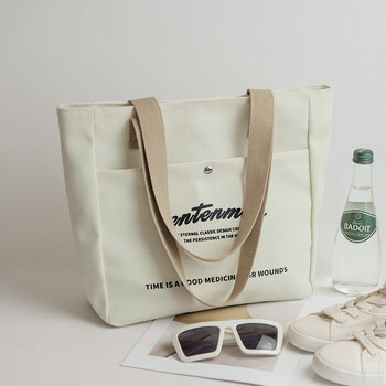 啄木鸟大容量帆布包女日系简约时尚字母学生布包上课书包上班休闲单肩