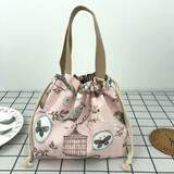 途尊（kingtrip）休闲女包手提包帆布包包时尚抽绳布艺小拎包百搭圆形饭盒包零钱袋 粉清新鸟笼【日系风简约款】