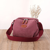 丝音帆布包女斜挎包2025新款潮简约复古百搭休闲单肩包韩版邮差小包女 紫咖色