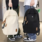 秀龍潮流简约双肩包男大容量休闲运动旅行电脑书包女大初高中学生背包 黑色带挂件17寸【简约纯色】26L