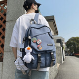 小憨象 书包男韩版高中大容量百搭双肩包女小学生时尚潮流ins风情侣背包 蓝色【小鸭子+3个徽章】