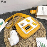 纸色  小女生包包斜跨包韩版新款可爱网红帆布小包包女新款日系可爱学生单肩包ins百搭撞色斜挎包 2065黄色【无挂件】 卡通小徽章