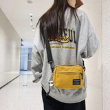 牧瑾潮牌斜挎包男士迷你小挎包女ins帆布单肩包休闲学生刷街轻便背包 黄色（带几何熊猫挂件）