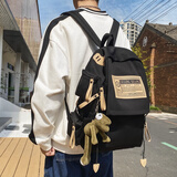 亚特龙 双肩包男韩版校园初中生高中学生书包女大容量小学生电脑背包 黑色＋挂件