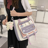 牧瑾单肩书包女小学生补习袋手提拎书袋大容量初中生大学生上课斜挎包 紫色（带徽章+兔头+腮红熊）
