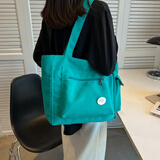 艾欣儿 女士帆布包大容量大学生上课通勤休闲百搭单肩斜挎手提包女大包日韩潮流托特包2022新款潮牌 绿色+徽章