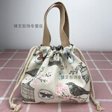 途尊（kingtrip）休闲女包手提包帆布包包时尚抽绳布艺小拎包百搭圆形饭盒包零钱袋 米色鸟笼【日系风简约款】