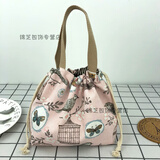 途尊（kingtrip）休闲女包手提包帆布包包时尚抽绳布艺小拎包百搭圆形饭盒包零钱袋 粉清新鸟笼【日系风简约款】