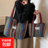 民族风老年人帆布包大容量2025新款潮时尚通勤托特包女加厚单肩包 酒红色(敞口款)小号22x27