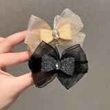 卓可可水钻蝴蝶结丸子头抓夹高级感马尾发夹女生后脑勺2025新款顶夹发饰