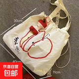 苹果新款抽绳帆布包学生轻便通勤百搭单肩包小众大容量简约托特包 白色苹果片片单肩包