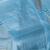 一次性加厚防护服参观防尘服反穿衣防水纹绣工作服淋膜民用 25gPP蓝色针织袖口
