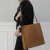袋鼠韩版时尚PU皮包简约通勤男女托特包方形竖款大容量手提包 黑色