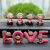 ZKHE汽车内饰品摆件创意网红吉祥物可爱男女车载装饰用品大全 嘴娃娃+love猪
