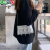 卡帝乐鳄鱼（CARTELO）韩国ins小众设计新款女包个性皮带装饰单肩腋下包辣妹休闲斜跨包 黑色