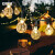 安赛瑞 太阳能灯串 景观装饰灯 防水八种模式led灯 气泡球 长12M 100灯 暖白 766056