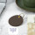咖啡色圆形卡套可以放直径4厘米